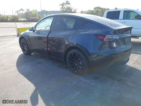 2024 Tesla Model Y with VIN 7SAYGDED4RF097142, listed as a IAAI auction lot 41484729 with 20 mi miles. Bid and sale history available at carsss.com. Image 3.