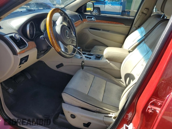 2011 Jeep Grand Cherokee Overland with VIN 1J4RR6GT8BC606688, listed as a Copart auction lot 57182295 with 100,423 mi miles and Salvage title. Bid and sale history available at DreamBid. Image 7.