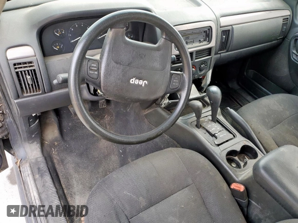 2004 Jeep Grand Cherokee Laredo z VIN 1J4GW48S54C357201, wystawiony jako Copart lot #59083985 z przebiegiem Nie podano mil oraz Nie do naprawy • Non repairable. Historia ofert i sprzedaży dostępna na DreamBid. Obrazek 8.