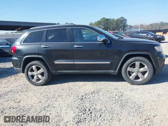 2013 Jeep Grand Cherokee Overland with VIN 1C4RJECG7DC644822, listed as a IAAI auction lot 41658872 with 156,838 mi miles. Bid and sale history available at carsss.com. Image 13.