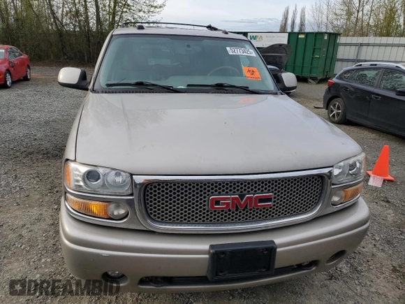 2005 GMC Yukon Denali z VIN 1GKEK63U65J262371, wystawiony jako Copart lot #52773425 z przebiegiem 129 028 mil mil oraz Czysty tytuł • Clean title. Historia ofert i sprzedaży dostępna na DreamBid. Obrazek 5.