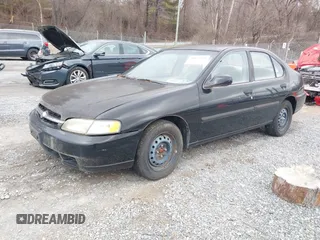 1999 Nissan Altima XE with VIN 1N4DL01DXXC148729, listed as a IAAI auction lot 41697641 with 187,596 mi miles. Bid and sale history available at carsss.com. Image 2.