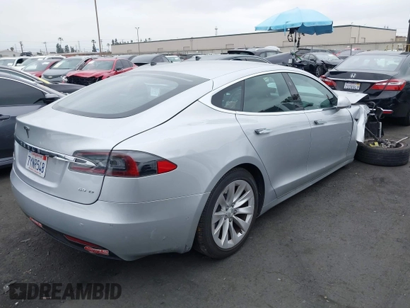 2017 Tesla Model S 100D with VIN 5YJSA1E24HF193563, listed as a IAAI auction lot 42120120 with 60,391 mi miles and . Bid and sale history available at DreamBid. Image 4.