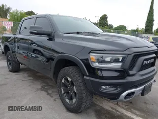 2023 Ram 1500 Rebel with VIN 1C6SRFLT7PN520661, listed as a IAAI auction lot 42397852 with 28,590 mi miles and . Bid and sale history available at DreamBid. Image 1.