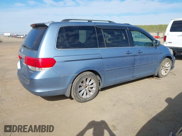 2008 Honda Odyssey Touring with VIN 5FNRL38868B047556, listed as a IAAI auction lot 41581617 with 220,436 mi miles. Bid and sale history available at carsss.com. Image 4.