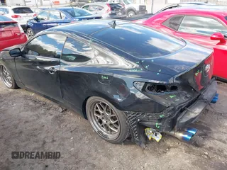 2013 Hyundai Genesis Coupe 2.0T z VIN KMHHT6KD2DU097886, wystawiony jako IAAI lot #41864894 z przebiegiem 152 642 mil mil oraz . Historia ofert i sprzedaży dostępna na DreamBid. Obrazek 3.
