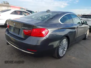 2014 BMW 4 Series 428i with VIN WBA3N7C5XEF719384, listed as a IAAI auction lot 41694678 with 115,517 mi miles and . Bid and sale history available at carsss.com. Image 4.