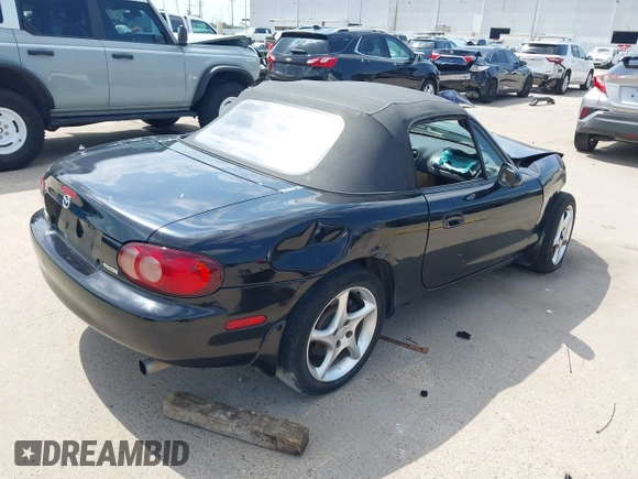 2002 Mazda MX-5 Miata Cloth with VIN JM1NB353520221312, listed as a IAAI auction lot 42410028 with 99,375 mi miles and . Bid and sale history available at DreamBid. Image 4.