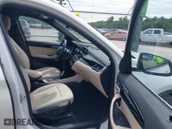 2021 BMW X1 xDrive28i with VIN WBXJG9C07M5U21337, listed as a IAAI auction lot 42590859 with 35,934 mi miles and . Bid and sale history available at DreamBid. Image 5.