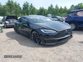 2021 Tesla Model S Long Range with VIN 5YJSA1E52MF438915, listed as a IAAI auction lot 40216222 with 15 mi miles and . Bid and sale history available at DreamBid. Image 1.