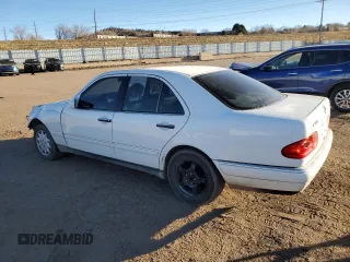 1999 Mercedes-Benz E-Class with VIN WDBJF82H1XX024280, listed as a Copart auction lot 83213204 with 212,712 mi miles and Salvage Title. Bid and sale history available at carsss.com. Image 2.