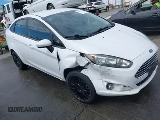 2019 Ford Fiesta SE z VIN 3FADP4BJ2KM143337, wystawiony jako IAAI lot #42179937 z przebiegiem 124 078 mil mil oraz . Historia ofert i sprzedaży dostępna na DreamBid. Obrazek 1.