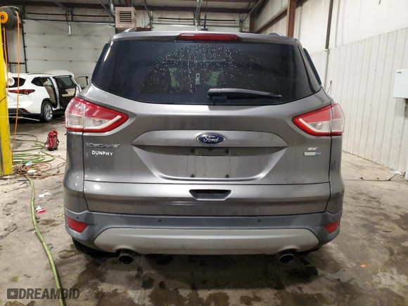 2014 Ford Escape SE with VIN 1FMCU9GX0EUC04253, listed as a Copart auction lot 83739424 with 0 mi miles and Salvage Title. Bid and sale history available at carsss.com. Image 6.