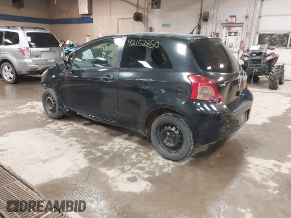 2008 Toyota Yaris with VIN JTDJT923285196299, listed as a IAAI auction lot 42152850 with 214,238 mi miles. Bid and sale history available at carsss.com. Image 3.