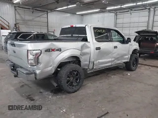 2015 Ford F-150 XLT with VIN 1FTEW1E89FFA44710, listed as a IAAI auction lot 41521584 with 158,297 mi miles. Bid and sale history available at carsss.com. Image 4.