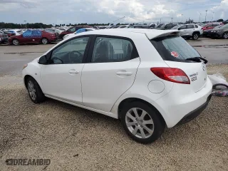2012 Mazda Mazda2 Touring with VIN JM1DE1LY8C0137590, listed as a Copart auction lot 74488974 with 0 mi miles and Salvage Title. Bid and sale history available at carsss.com. Image 2.