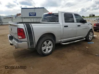 2012 Ram 1500 Express with VIN 1C6RD7KT1CS142370, listed as a Copart auction lot 60756925 with 106,627 mi miles and Salvage title. Bid and sale history available at DreamBid. Image 3.