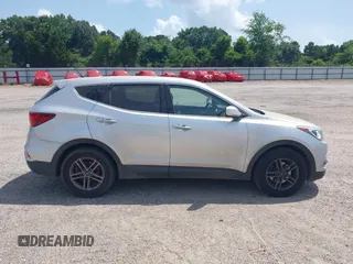 2018 Hyundai Santa Fe 2.4L with VIN 5XYZT3LB4JG557373, listed as a IAAI auction lot 42511741 with 142,572 mi miles and . Bid and sale history available at DreamBid. Image 14.