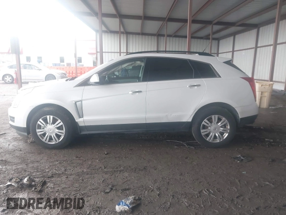 2014 Cadillac SRX z VIN 3GYFNAE32ES580480, wystawiony jako IAAI lot #42170765 z przebiegiem 148 245 mil mil oraz . Historia ofert i sprzedaży dostępna na DreamBid. Obrazek 14.