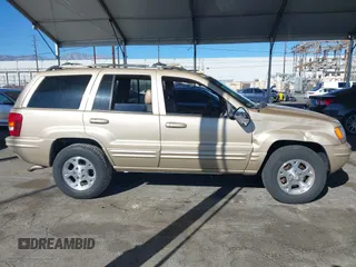 1999 Jeep Grand Cherokee Limited with VIN 1J4GW68NXXC727844, listed as a IAAI auction lot 41290773 with 222,838 mi miles. Bid and sale history available at carsss.com. Image 14.