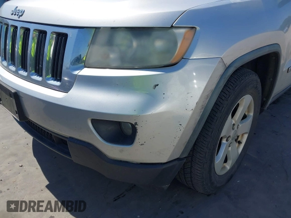 2012 Jeep Grand Cherokee Laredo with VIN 1C4RJEAG5CC112230, listed as a IAAI auction lot 41997483 with 302,923 mi miles. Bid and sale history available at carsss.com. Image 6.