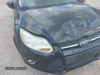 2013 Ford Focus SE z VIN 1FADP3F2XDL354156, wystawiony jako IAAI lot #42231744 z przebiegiem 123 518 mil mil oraz . Historia ofert i sprzedaży dostępna na DreamBid. Obrazek 12.