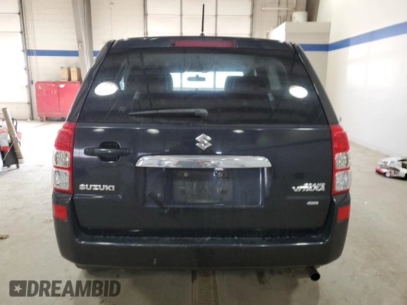2012 Suzuki Grand Vitara Premium z VIN JS3TD0D66C4100814, wystawiony jako Copart lot #89250025 z przebiegiem 102 381 mil mil oraz Szkody całkowita. Historia ofert i sprzedaży dostępna na DreamBid. Obrazek 6.