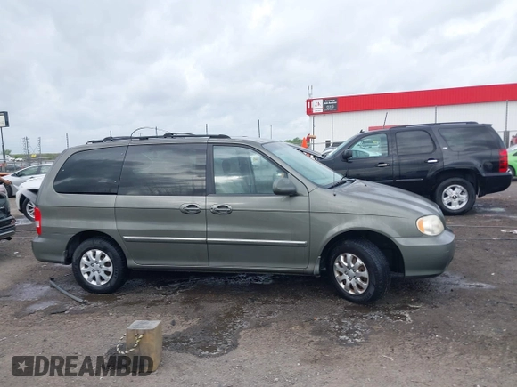 2005 Kia Sedona LX with VIN KNDUP132656734193, listed as a IAAI auction lot 41892342 with 91,768 mi miles. Bid and sale history available at carsss.com. Image 13.
