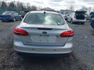 2016 Ford Focus S with VIN 1FADP3E2XGL311099, listed as a IAAI auction lot 41855282 with 196,444 mi miles. Bid and sale history available at carsss.com. Image 17.