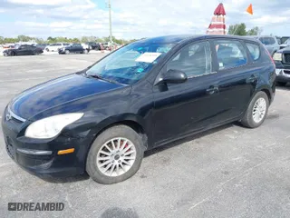 2010 Hyundai Elantra Touring GLS with VIN KMHDB8AE7AU075949, listed as a IAAI auction lot 41426249 with 231,611 mi miles. Bid and sale history available at carsss.com. Image 2.