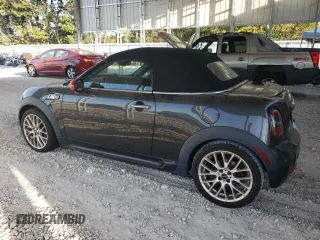 2015 MINI Roadster S z VIN WMWSY3C59FT566785, wystawiony jako Copart lot #73574064 z przebiegiem 96 623 mil mil oraz Tytuł czysty. Historia ofert i sprzedaży dostępna na DreamBid. Obrazek 2.