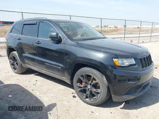 2015 Jeep Grand Cherokee Summit with VIN 1C4RJFJM1FC867861, listed as a IAAI auction lot 42034207 with 92,205 mi miles and . Bid and sale history available at DreamBid. Image 1.