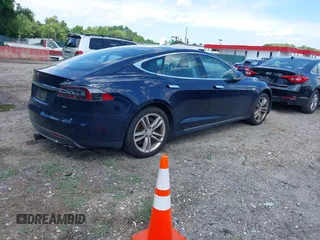 2013 Tesla Model S with VIN 5YJSA1CN0DFP21851, listed as a IAAI auction lot 42557791 with 106,328 mi miles and . Bid and sale history available at DreamBid. Image 4.
