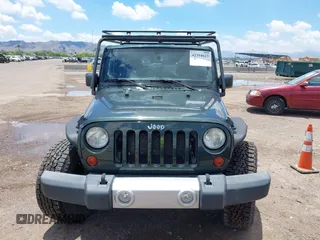 2012 Jeep Wrangler Sahara z VIN 1C4AJWBGXCL100527, wystawiony jako IAAI lot #42394623 z przebiegiem 126 097 mil mil oraz . Historia ofert i sprzedaży dostępna na DreamBid. Obrazek 12.