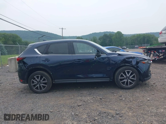 2018 Mazda CX-5 Grand Touring with VIN JM3KFBDMXJ0361812, listed as a IAAI auction lot 42509752 with 131,386 mi miles and . Bid and sale history available at DreamBid. Image 14.