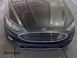 2020 Ford Fusion SE z VIN 3FA6P0HD6LR189762, wystawiony jako IAAI lot #42780149 z przebiegiem 51 099 mil mil oraz . Historia ofert i sprzedaży dostępna na DreamBid. Obrazek 15.