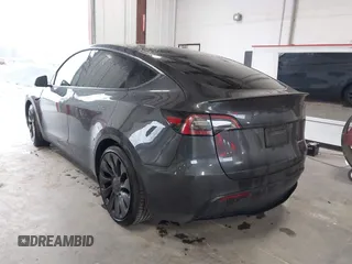 2024 Tesla Model Y Performance with VIN 7SAYGDEFXRF049338, listed as a IAAI auction lot 41240812 with 10,132 mi miles and . Bid and sale history available at DreamBid. Image 3.