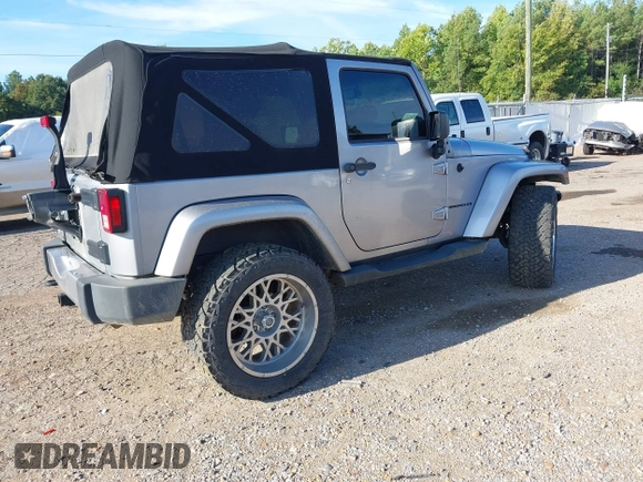 2016 Jeep Wrangler Sahara z VIN 1C4AJWBGXGL120329, wystawiony jako IAAI lot #40239916 z przebiegiem 96 731 mil mil oraz . Historia ofert i sprzedaży dostępna na DreamBid. Obrazek 4.