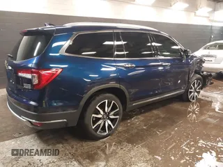 2022 Honda Pilot Touring 7-Passenger with VIN 5FNYF6H65NB052164, listed as a IAAI auction lot 41641601 with 51,700 mi miles. Bid and sale history available at carsss.com. Image 4.
