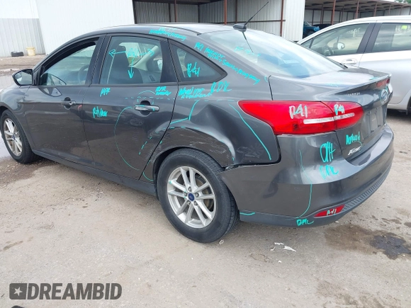 2017 Ford Focus SE with VIN 1FADP3F23HL232809, listed as a IAAI auction lot 42117700 with 104,802 mi miles and . Bid and sale history available at DreamBid. Image 3.