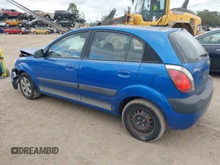 2009 Kia Rio LX with VIN KNADE243296494243, listed as a IAAI auction lot 41307888 with 133,487 mi miles. Bid and sale history available at carsss.com. Image 3.