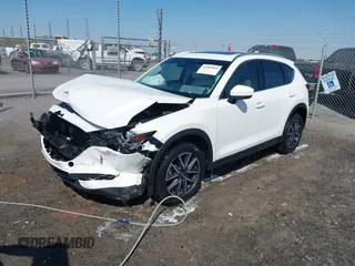 2018 Mazda CX-5 Grand Touring with VIN JM3KFBDM0J0404635, listed as a IAAI auction lot 41883068 with 71,178 mi miles. Bid and sale history available at carsss.com. Image 2.