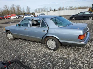 1986 Mercedes-Benz 300 with VIN WDBCB25D9GA279756, listed as a Copart auction lot 46860345 with 210,386 mi miles and Salvage Title. Bid and sale history available at carsss.com. Image 2.