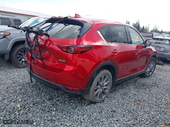 2021 Mazda CX-5 Grand Touring with VIN JM3KFBDM4M1455540, listed as a IAAI auction lot 41937166 with 1 mi miles. Bid and sale history available at carsss.com. Image 4.