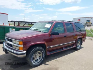 1999 Chevrolet Suburban with VIN 1GBFK16R5XJ335005, listed as a IAAI auction lot 42542755 with 200,599 mi miles and . Bid and sale history available at DreamBid. Image 2.