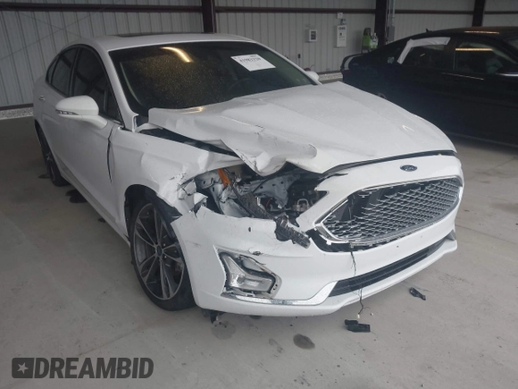 2019 Ford Fusion Titanium with VIN 3FA6P0K95KR271291, listed as a IAAI auction lot 41983320 with 71,962 mi miles and . Bid and sale history available at DreamBid. Image 6.