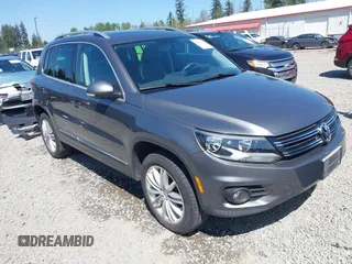 2013 Volkswagen Tiguan SEL with VIN WVGBV3AX1DW595673, listed as a IAAI auction lot 42140263 with 77,457 mi miles and . Bid and sale history available at DreamBid. Image 1.