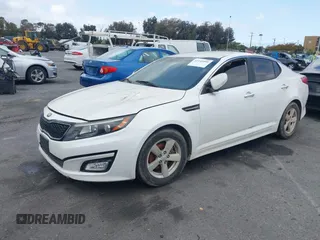 2015 Kia Optima LX with VIN KNAGM4A70F5644189, listed as a IAAI auction lot 42141090 with 140,346 mi miles. Bid and sale history available at carsss.com. Image 2.