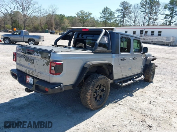 2021 Jeep Gladiator Freedom with VIN 1C6HJTAG3ML540967, listed as a IAAI auction lot 41883858 with 92,287 mi miles and . Bid and sale history available at DreamBid. Image 4.
