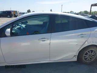 2021 Toyota Prius LE with VIN JTDKAMFP2M3177459, listed as a IAAI auction lot 42093828 with 65,501 mi miles and . Bid and sale history available at DreamBid. Image 14.